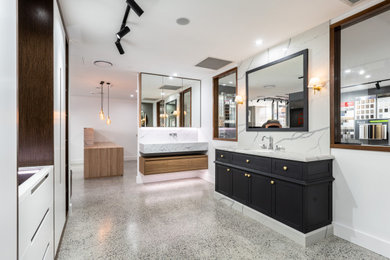 Design ideas for a mid-sized modern bathroom in Sydney with stone slab, marble benchtops and a built-in vanity.