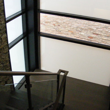 Glass and Metal Staircase in a Contemporary Glass Stairwell