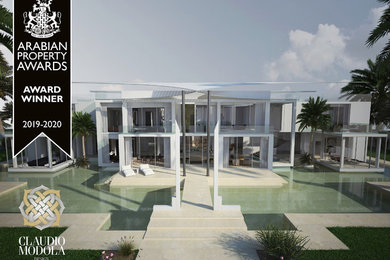Idee per la villa grande bianca contemporanea a tre piani con rivestimento in stucco, tetto piano e copertura verde