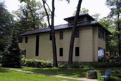 Large transitional beige two-story stucco exterior home idea in Phoenix