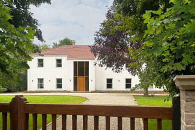 Photo of a contemporary house exterior in Cambridgeshire.