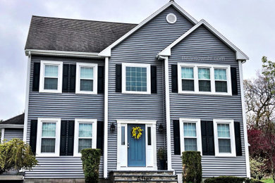 Traditional gray two-story vinyl house exterior idea in Boston with a clipped gable roof and a shingle roof