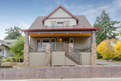 This is an example of a mid-sized arts and crafts two-storey brown exterior in Portland.