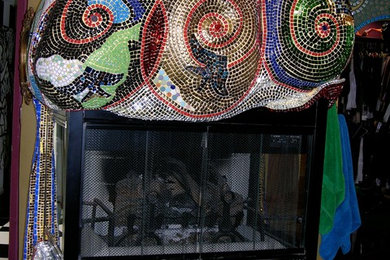 Mid-sized eclectic enclosed living room photo in Los Angeles with yellow walls, a standard fireplace and a tile fireplace