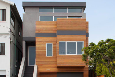Inspiration for a contemporary gray three-story wood exterior home remodel in San Francisco