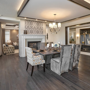 エドモントンの広いトランジショナルスタイルのLDKの画像 (ベージュの壁、濃色無垢フローリング、両方向型暖炉、タイルの暖炉まわり)