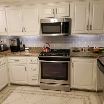 cabinet refacing before and afters--white cabinets with gray splash