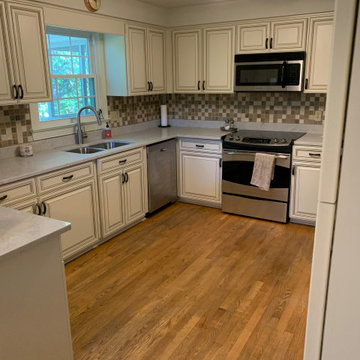 Cabinet reface antique white cabinets.. quartz countertop