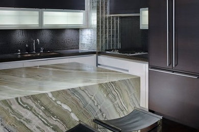 Eat-in kitchen - contemporary u-shaped medium tone wood floor eat-in kitchen idea in Las Vegas with marble countertops, black backsplash, mosaic tile backsplash, paneled appliances and an island