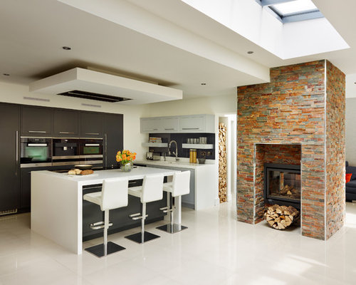 Inspiration for a contemporary kitchen in London with an island.