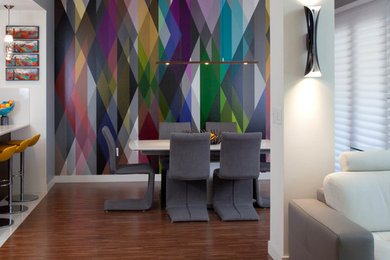 Inspiration for a small contemporary medium tone wood floor kitchen/dining room combo remodel in San Diego with multicolored walls