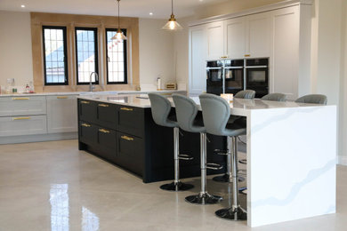 This is an example of an expansive traditional kitchen in Other.