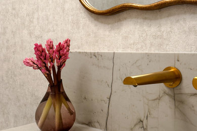Example of a transitional powder room design in Toronto
