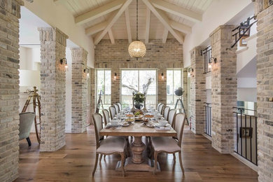 Dining room - traditional medium tone wood floor and brown floor dining room idea in Orange County with beige walls