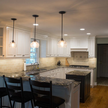 White Tradition Kitchen with a Black Island in Magnolia, DE