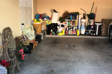 Garage - mid-sized modern attached two-car garage idea in Austin