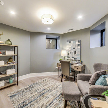 Moody Primary Bedroom with Dramatic Accent Wall and Warm Wood Floors