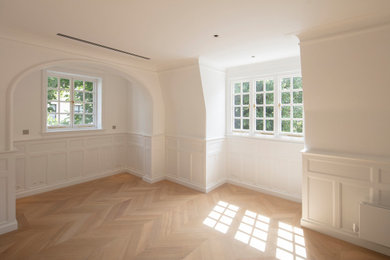 Photo of a medium sized traditional guest bedroom in London with white walls.