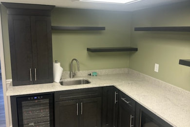 Enclosed kitchen - small transitional l-shaped enclosed kitchen idea in Atlanta with shaker cabinets and dark wood cabinets
