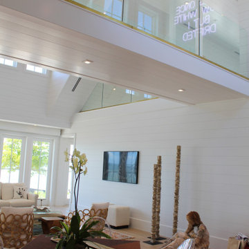 Glass Balustrade with Aluminum Base Rail Finished with Satin Brass Cladding