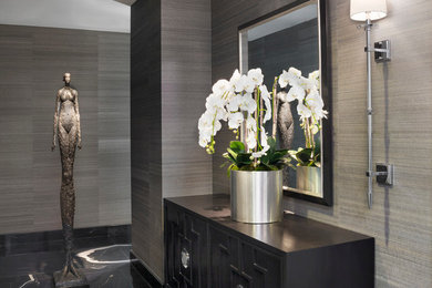 Entryway - small contemporary granite floor entryway idea in Los Angeles with gray walls and a white front door