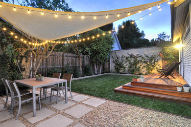 Example of a trendy backyard concrete paver patio design in Los Angeles