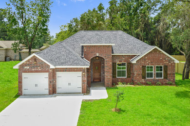 Traditional one-story house exterior idea in Other with a shingle roof