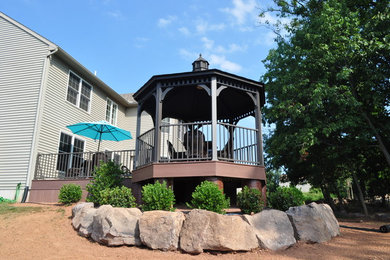Inspiration for a mid-sized timeless backyard deck remodel in Other
