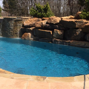 Custom Pool with Beach Entry and Large Waterfall