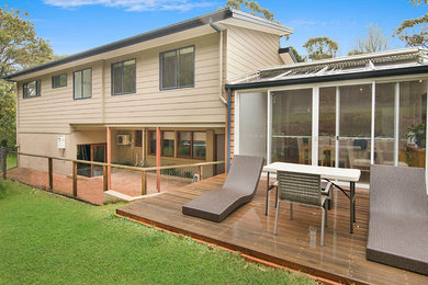 Inspiration for a small transitional backyard deck in Sydney with no cover.