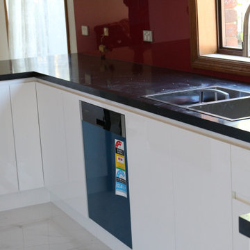 Black Kitchen benchtop with stainless steel sink