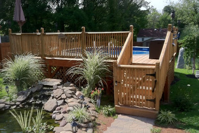 Example of a small classic backyard aboveground pool design in Philadelphia