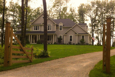 Inspiration for a timeless gray two-story vinyl exterior home remodel in New York