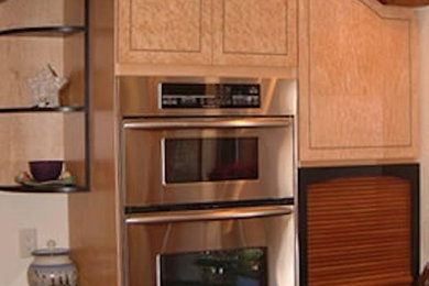 Open concept kitchen - large contemporary l-shaped open concept kitchen idea in Denver with an undermount sink, flat-panel cabinets, light wood cabinets, granite countertops, stainless steel appliances and an island