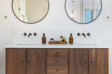 Bathroom - mid-sized modern master white tile slate floor and gray floor bathroom idea in Orange County with flat-panel cabinets, medium tone wood cabinets, white walls, an undermount sink and white countertops