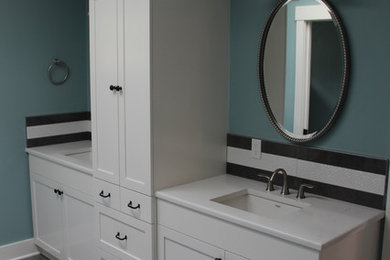 Bathroom - large transitional master black tile, black and white tile, white tile and mosaic tile porcelain tile bathroom idea in Portland with shaker cabinets, white cabinets, a two-piece toilet, green walls, an undermount sink and quartz countertops