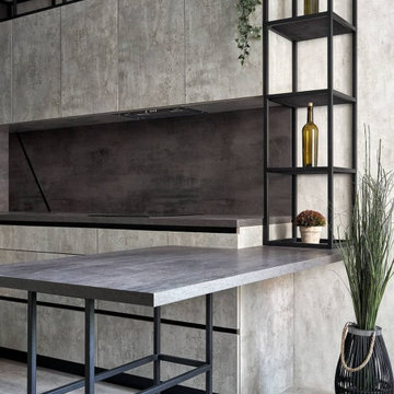 Дизайнерская угловая кухня серого цвета в стиле лофт с барной стойкой