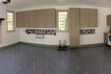 Inspiration for a mid-sized timeless attached two-car garage workshop remodel in Philadelphia