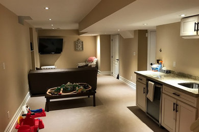 Example of a trendy family room design in Toronto