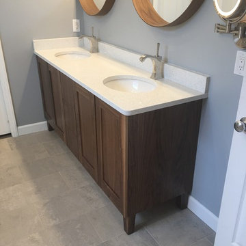 Vanity with custom countertops & imposing faucets