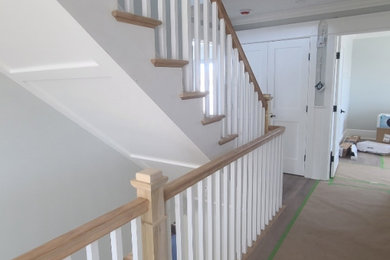 Example of a large classic wooden straight wood railing staircase design in Philadelphia with wooden risers