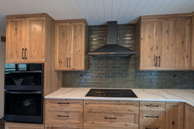 Eat-in kitchen - mid-sized transitional l-shaped eat-in kitchen idea in Other with light wood cabinets, quartz countertops and an island