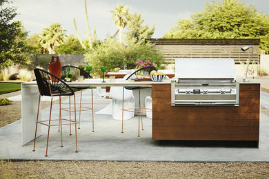 Patio - large contemporary backyard concrete patio idea in Phoenix with no cover