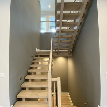 White Oak Stairs with Polished Stainless Steel Balusters