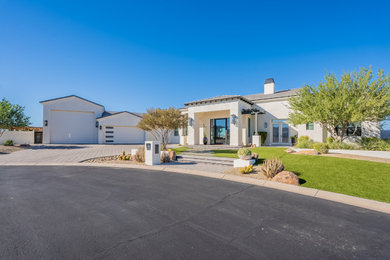Mid-sized traditional white one-story house exterior idea in Phoenix with a tile roof and a gray roof