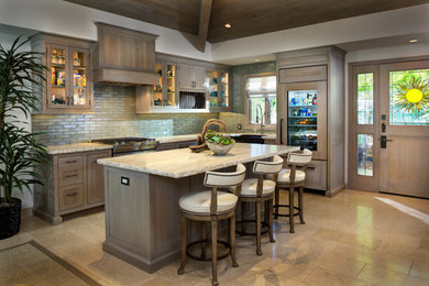 Small transitional l-shaped limestone floor, beige floor and wood ceiling eat-in kitchen photo in Sacramento with a farmhouse sink, beaded inset cabinets, light wood cabinets, quartzite countertops, gray backsplash, glass tile backsplash, paneled appliances, an island and white countertops