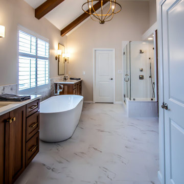 Luxury Spa Bathroom with Natural Warm Vanities, Quartz Countertop, Tiled Shower