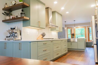 Inspiration for a mid-sized transitional galley eat-in kitchen remodel in Other with shaker cabinets, green cabinets and quartz countertops