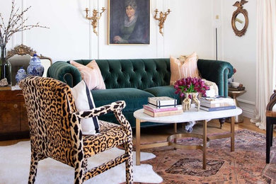 Example of a brown floor living room design in DC Metro with white walls and no tv