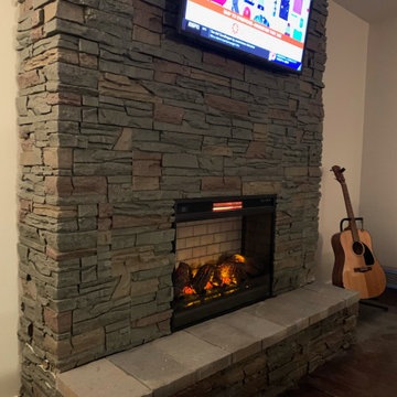 TV Above the Fireplace Design Ideas with Keystone Stacked Stone